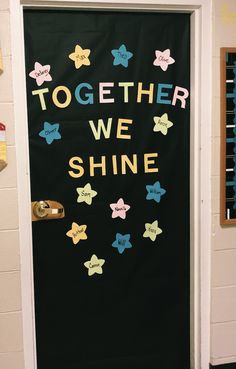 a door decorated with stars and the words together we shine