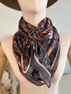 Experience luxury with the Bohemian Bliss Wild Rag. Made with extra fine satin silk, this 39" square scarf features a boho daisy and medallion print. The versatile design is perfect for any outfit or occasion and the earthy tones add a classic touch. Elevate your wardrobe with this must-have accessory. - 39" x 39” satin silk Bohemian Silk Scarf, Luxury Handmade Bohemian Silk Scarf, Brown Bohemian Silk Scarves, Luxury Black Bohemian Silk Scarf, Western Wild, Black Bohemian Silk Scarf, One Size, Bloom And Wild, Wild Rag, Chic Accessories