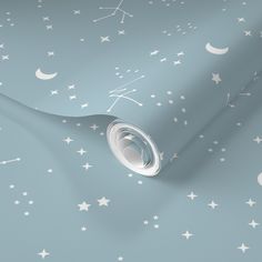 a blue wallpaper with white stars and crescents on the surface, as well as a light blue background