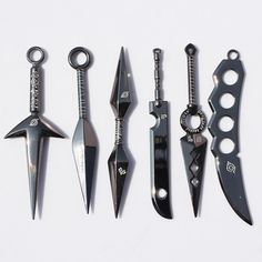 there are many different types of knifes in this photo, but one is black and white