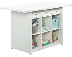 a white bookcase with several compartments on it