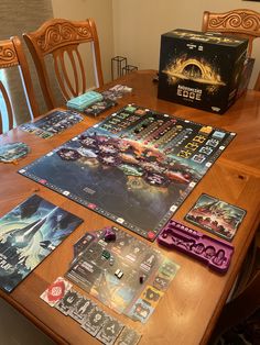 the board game star wars is set up on a dining room table with other games