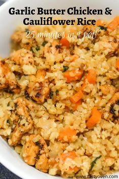 garlic butter chicken and cauliflower rice in a white bowl with the title above it