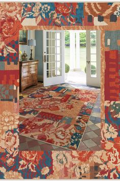 an ornate rug is in the middle of a room