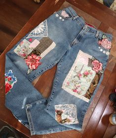 This beauty is a size 12 Miss Levis Classic Relaxed Stretch 550 Jeans  hand embroidered distressed embellished  with floral applique and lace detail    Has some stretch. Tapered leg  Front Rise:     11 In. Back Rise:       15 In.      Waist:              33 In. Hip:                 44 In. Inseam:          27 In. Thigh:             22 In.   Length:          38 In. They are one of a kind, upcycled jeans,  that been well loved, have unique imperfections  But I give them a unique modern renewal and Upcycled Jeans, Look Festival, Crochet Dollies, Woman Jeans, Upcycle Jeans, Patchwork Jeans, Denim Patchwork, Fabric Patch, Floral Applique