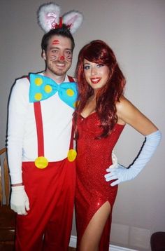 a man and woman dressed up in costumes posing for a photo with bunny ears on their head