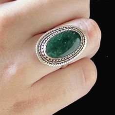 This Retro handmade  Boho Hippie  style ring is 925 sterling silver set with a smooth flat Oval natural Green moss agate. It is In very good vintage condition with normal wear patina on the silver band. The large oval agate is absolutely beautiful tone of emerald green and is set in a plain bezel with a twisted silver wire surrounds .Stamped 925 size 9US. Boho Hippie Style, Green Moss Agate, Handmade Boho, Moss Agate, Hippie Style, Boho Hippie, Silver Wire, Silver Band, Statement Ring