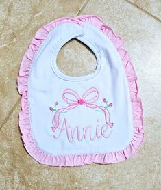 Monogrammed Ruffle Baby Bibs  These super soft 100% cotton bibs are the perfect gift for a baby shower, birthday and for everyday use. A great  gift or accessory to wear any day or time. This listing is for 1 ruffle bib monogrammed with font/design as shown in the listing photos.  Colors: see image above Fonts: see image above These are standard size with a snap closure and unbelievably soft. Please include the following info for each bib in the notes section: 1) initials in monogram order (firs Pink Cotton Bib As A Gift, Pink Cotton Bib As Gift, Cute Pink Bib For Gift, Cute Pink Bib As A Gift, Cute Pink Bib As Gift, Personalized Cotton Bib As Gift, White Machine Washable Bib For Gift, White Machine Washable Bib As A Gift, White Machine Washable Bib As Gift