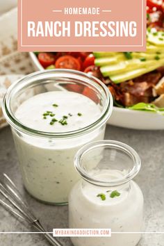 ranch dressing in a glass jar next to a salad