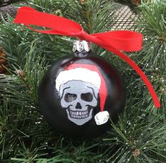 a christmas ornament with a skull painted on it