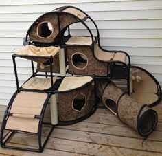 the cat house is made out of several different types of scratching pads and scratch sticks