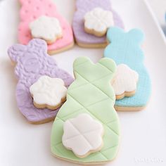 decorated cookies in the shape of pineapples on a plate