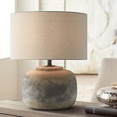 a table lamp sitting on top of a wooden table