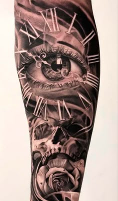 an arm with a clock and eye tattoo design on it's leg, in black and white