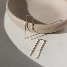 A minimal earring that's perfect for everyday. Wear them in your second ear holes or let them be the main adornment for your ear lobes! Either way, these earrings will become one of your daily staples (pun, intended!). DETAILSThe earrings measure approx. 1.25" long by .25" wideChoose from 14k gold fill or sterling silverHypoallergenic, waterproof, and nickel free Staple Earrings, Let Them Be, Jewelry Staples, Minimal Earrings, Forever Jewelry, Gold Gifts, Earring Sale, Geometric Earrings, Charm Jewelry