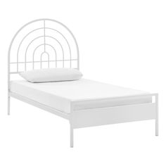 a white bed with a metal headboard and foot board