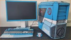 a blue computer with a keyboard and monitor