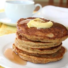 a stack of pancakes with butter on top