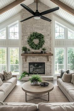 a living room filled with furniture and a fire place in front of a stone fireplace