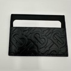 Burberry Embossed Leather Card Case. (Black) Brand New. Never Used. Perfect Unisex Gift! Reposhing This Item I Purchased From @Threadandsole. Loved It, But Ready To Rotate For Something New. Questions? Leave A Comment Below! Luxury Black Card Holder For Everyday Use, Luxury Black Card Holder With Embossed Logo, Black Rectangular Card Holder With Engraved Logo, Black Leather Card Holder With Engraved Logo, Burberry Card Holder, Burberry Accessories, Burberry Black, Leather Card Case, Unisex Gift