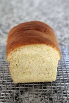 a loaf of bread sitting on top of a cooling rack