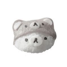 a white and gray stuffed animal with black buttons on it's head, sitting in front of a white background