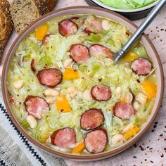 a bowl filled with sausage and cabbage soup