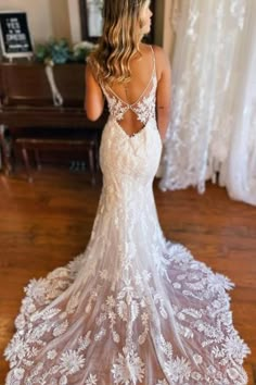 a woman in a wedding dress looking back