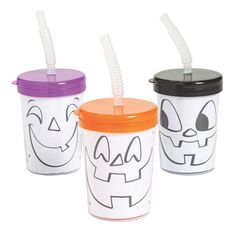 three halloween cups with lids and straws in them