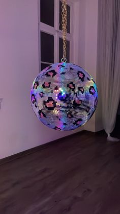 a disco ball hanging from a ceiling in a room