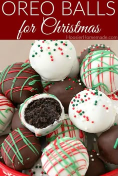 chocolate covered oreo balls in a red bowl with white and green sprinkles