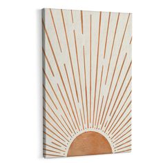 an orange and white sunburst painting on a wooden wall mounted to the side of a