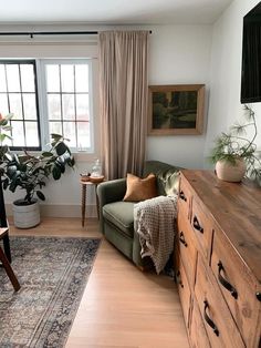 a living room filled with furniture and a large window