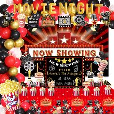 a movie night party with balloons, popcorns and streamers in front of it