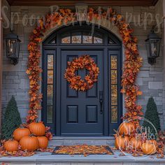 a front door decorated with pumpkins and leaves