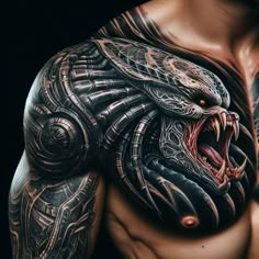 a man's chest with an intricate tattoo design on his arm and shoulder is shown