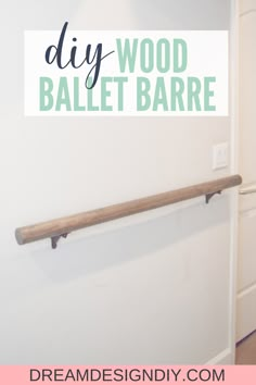 the diy wood ballet bar is hanging on the wall