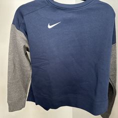 New With Tags Nike Sweatshirt Womens Small Blue And Gray Womens Dh3780-419 $55.00 Pullover Blue Athleisure Sweatshirt With Ribbed Cuffs, Navy Long Sleeve Sweatshirt Athleisure, Navy Sportswear Sweatshirt For Fall, Navy Crew Neck Sweatshirt In Athleisure Style, Navy Long Sleeve Sportswear Sweatshirt, Navy Long Sleeve Sweatshirt Sportswear, Navy Crew Neck Top With Ribbed Cuffs, Navy Crew Top With Ribbed Cuffs, Navy Long Sleeve Tops With Ribbed Cuffs