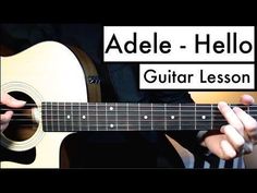 someone playing an acoustic guitar with the words adele - hello on top of it