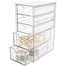 three drawers with different types of items in them, one is clear and the other has several