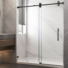 a bathroom with a sink, mirror and walk in shower next to a counter top