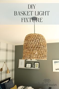 a basket light fixture hanging over a bed