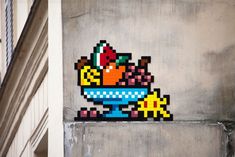 a sticker on the side of a building with a bowl of fruit in it