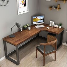 a corner desk with a computer on it