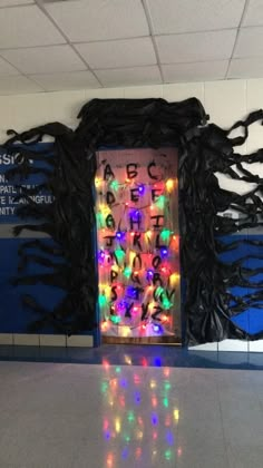 an open door decorated with lights and letters