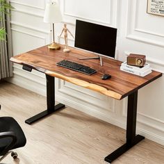 a wooden desk with a computer on it