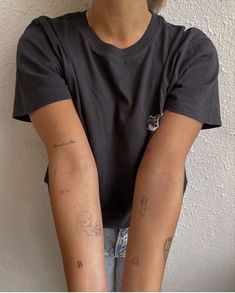 a person with tattoos on their arms