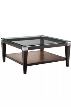 a coffee table with glass top and wooden frame on the bottom, against a white background