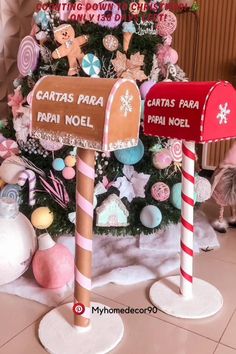 a christmas tree decorated with candy canes and mailboxes for santa's day