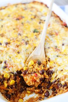 a casserole dish filled with beans, corn and cheese